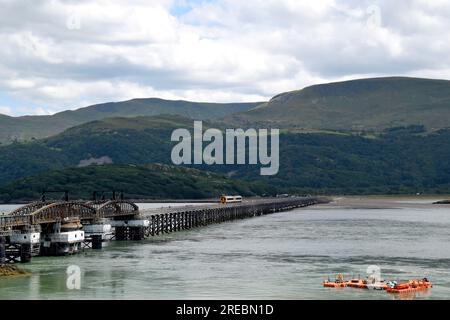 A Transport For Wales Class 158 Express DMU crossing Barmouth Bridge, approaching Barmouth Station, Gwynedd, Wales, July 2023 Stock Photo
