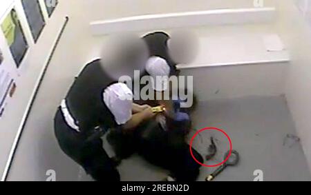 BEST QUALITY AVAILABLE Screen grab taken from handout CCTV dated 25/09/20 issued by the Metropolitan Police of a weapon (circled in red) laying on the floor, as officers wrestle Louis De Zoysa to the floor, moments after Sergeant Matt Ratana was fatally shot inside a custody block at Croydon custody centre. De Zoysa, will be sentenced by a High Court judge at Northampton Crown Court on Thursday for the murder of Sergeant Matt Ratana. Issue date: Thursday July 27, 2023. Stock Photo