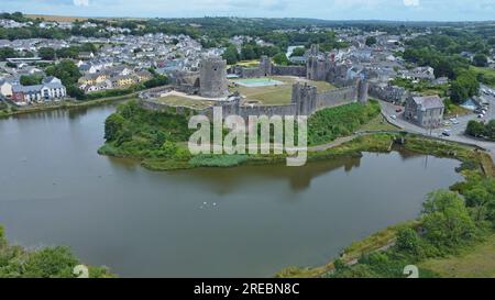 Aerial drone view of Pembroke Castle, a large medieval fortification in Pembrokeshire, West Wales. Stock Photo