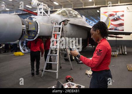 California, USA. 16th July, 2023. Aviation Ordnanceman 1st Class Rholanda Tucker, from Palmdale, California, assigned to the ''Blacklions'' of Strike Fighter Squadron (VFA) 213, conducts routine maintenance on the 20mm gun from an F/A-18F Super Hornet in the hangar bay of the world's largest aircraft carrier USS Gerald R. Ford (CVN 78), July 16, 2023. Gerald R. Ford is the U.S. Navy's newest and most advanced aircraft carrier, representing a generational leap in the U.S. Navy's capacity to project power on a global scale. The Gerald R. Ford Carrier Strike Group is on a scheduled deployment in Stock Photo