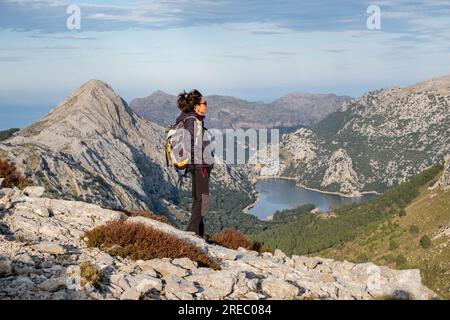 trekker in front of the Gorg Blau reservoir, Escorca, Mallorca, Balearic Islands, Spain Stock Photo