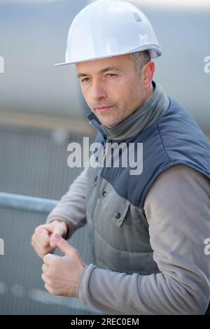 male industrial worker wearing hardhat Stock Photo