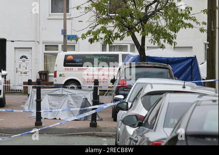 Harrow Street, Wolverhampton, 27th July 2023: West Midlands Police at the scene of a murder investigation which has been launched after two men were stabbed in the area of Harrow Street, Whitmore Reans in Wolverhampton on Thursday 27th July morning at 5am. A blue forensic tent was erected along with 3 small silver tents. A further white tent was placed on a nearby road covering what is believed to be a vehicle. One man suffered fatal injuries and was pronounced dead at the scene, another man has been taken to hospital with serious injuries. A man in his 20s has been detained. A cordon is in pl Stock Photo