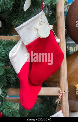 Christmas Stockings Hanging On Wooden Plate Stock Photo - Alamy