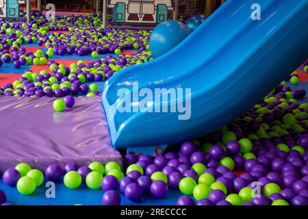 playground with slide and Colored plastic balls Stock Photo