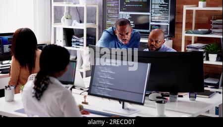 African Business Team Working On Computer. Software App Development Stock Photo