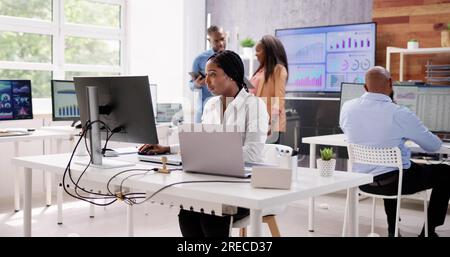 Professional Woman Using Computer Technology In Office Stock Photo