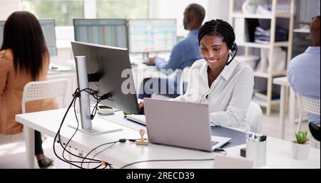 Portrait Of A Smiling African Female Customer Service Executive Stock Photo