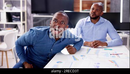 Workplace Quarrel. Angry Looking Man Looking In Camera Stock Photo