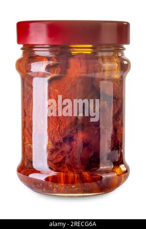 Dried tomatoes in oil Sicilian style in glass jar isolated on white with clipping path included Stock Photo
