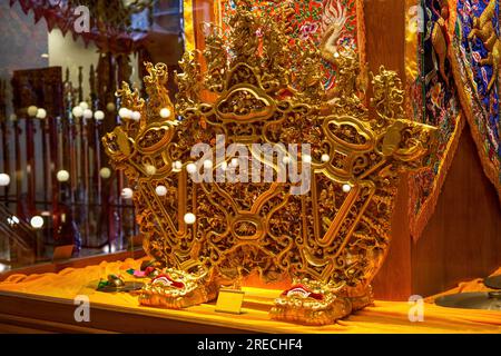 Close-up of traditional Chinese golden sedan chair and decorations for sacrifice Stock Photo