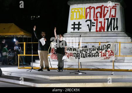 Men salute during a Constitutional Court protest at Thammasat University Rangsit in Pathum Thani, Thailand. Thailand's Constitutional Court ordered a temporary suspension of prime ministerial hopeful Pita Limjaroenrat and will to rule on his prime minister renomination rejection. Stock Photo