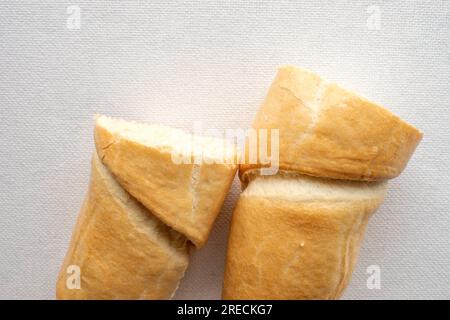 Salted Stick Bread: A close-up photo of delicious crunchy stick bread with a salted seasoning is displayed on a clean white surface. Perfect for snack Stock Photo