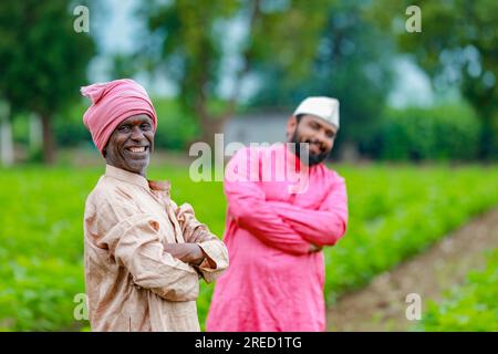 Indian farming, two farmer standing in farm , happy farmer , farmer and worker Stock Photo