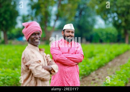 Indian farming, two farmer standing in farm , happy farmer , farmer and worker Stock Photo