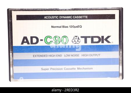 Close up of vintage audio tape cassette case AD-C90 TDK isolated on white background, vintage 80's music concept. Stock Photo