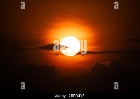 Beautiful colorful dramatic sky with clouds at sunset or sunrise. dark dawn Stock Photo