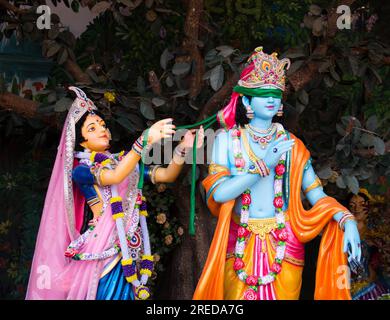 Colorful life size idols of Krishna, Radha at Prem Mandir temple. Happy Krishna Janmashtami. selective focus on subject. Stock Photo