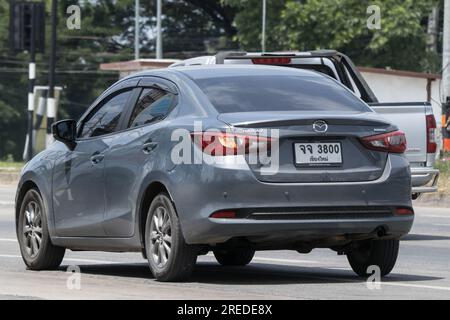 Chiangmai, Thailand -   June  17 2023: Private Eco car Mazda 2. On road no.1001 8 km from Chiangmai Business Area. Stock Photo