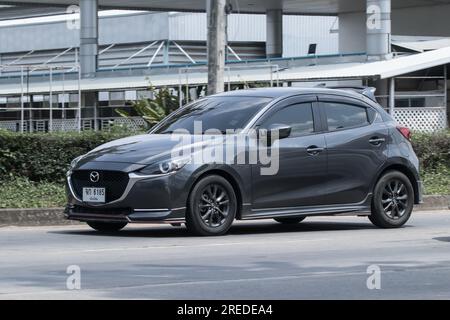 Chiangmai, Thailand -   June  17 2023: Private Eco car Mazda 2. On road no.1001 8 km from Chiangmai Business Area. Stock Photo