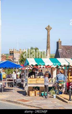 The outdoor Thursday market in the Cross Square in the city of St Davids in the Pembrokeshire Coast National Park, West Wales UK Stock Photo