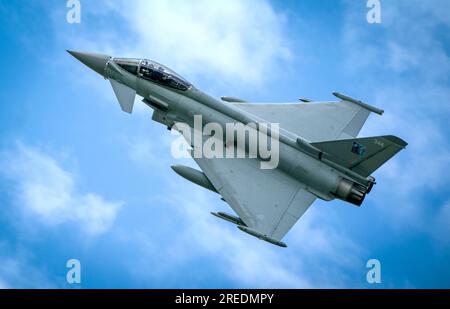 A Typhoon fighter jet in the skies above the Amari Airbase in Estonia. Here a squadron of RAF Typhoon jets are deployed on Operation Azotize the UK's commitment to NATO's Baltic Air policing mission. Picture date: Thursday July 27, 2023. Stock Photo