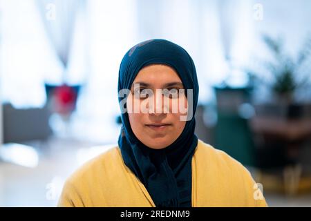 Positive adult Middle Eastern woman with hijab Stock Photo