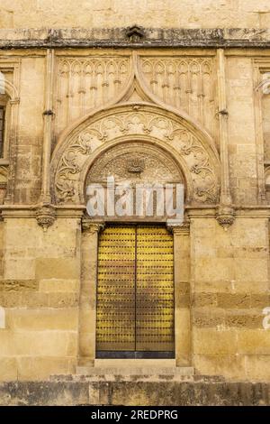 Cordoba, Spain - 25. May 2022: Beautiful patterns of the exterior wall with gate of the magnificent Mosque of Cordoba. Present day's Mezquita Cathedra Stock Photo