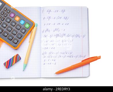 Copybook with maths formulas, calculator and stationery isolated on white background Stock Photo