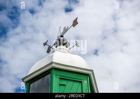 Known as The Governor, the green & white lighthouse stands on the harbour wall of Port Erin on the Isle of Man since 1916 Stock Photo