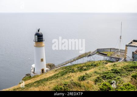 Maughold Head lighthouse stands on the Isle of Man's most Easterly point, protecting shipping since 1914. Updated to LED from paraffin lamp in 1993 Stock Photo