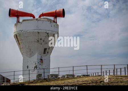 Red and white flaking paintwork on the Lighthouse and Foghorn at Point of Ayre on the Isle of Man Stock Photo