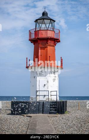 Red and white flaking paintwork on the Lighthouse and Foghorn at Point of Ayre on the Isle of Man Stock Photo