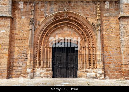 Portal of Nuestra Señora de la Asunción collegiate church (13th-18th century) rebuilt in 1440 in the Lombard-Gothic style, The church is placed in the Stock Photo