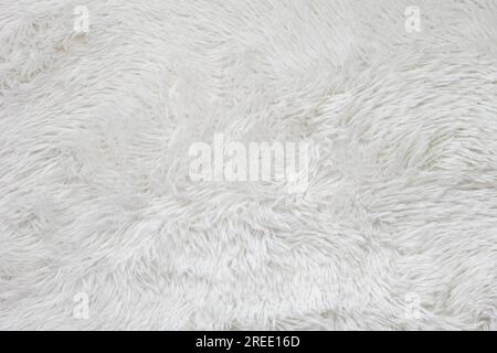 A white artificial fur background. Close up. Stock Photo