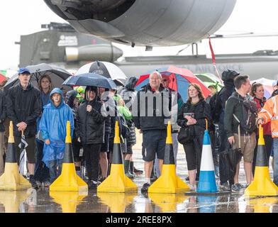 Royal Air Force Fairford, Fairford, Gloucestershire, England, 14th July 2023. Crowds wait in anticipation for the royal family to arrive despite the weather during, the Royal International Air Tattoo 2023, Royal Air Force Fairford. (Credit Image: ©Cody Froggatt/Alamy Live News) Stock Photo