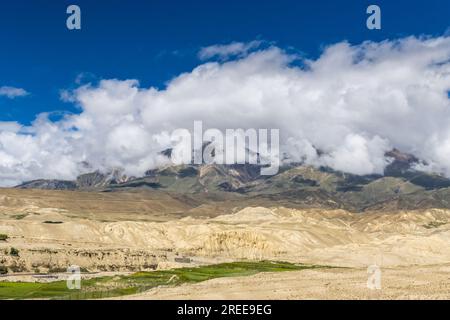 Desert Mountainous Landscape of Chosar Valley in Lo Manthang, Upper Mustang of Nepal Stock Photo