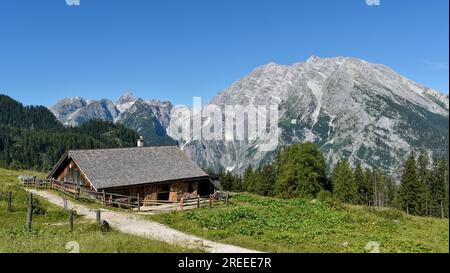Alpine hut of the Priesbergalm in front of the Watzmann in the Berchtesgaden National Park, Bavaria, Germany Stock Photo