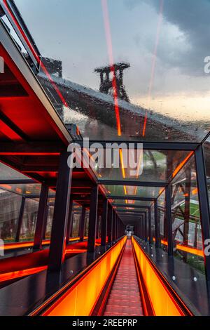 Zollverein colliery, rainy day, riding the escalator of the Ruhr Museum, in the coal washing plant, looking at the double trestle winding tower of sha Stock Photo