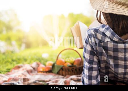 Woman relaxing reading book park. Resolution and high quality beautiful photo Stock Photo