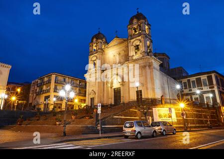 Dawn, super wide angle, oblique, from below, illuminated church, blue night sky, Zafferana Etnea, Etna, volcano, Eastern Sicily, Sicily, Italy Stock Photo