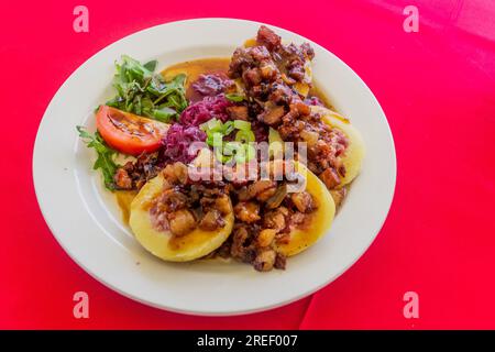 Czech meal - bacon filled potato dumplings with cabbage Stock Photo