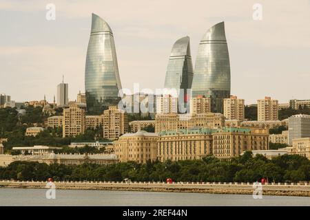Baku, Azerbaijan - June 28, 2023: A picturesque morning view of Baku's iconic Flame Towers basking in the soft sunlight. The slight overcast sky adds Stock Photo