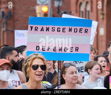 March for trans and Queer Justice - Sign Trans  Defender held by march participant Stock Photo