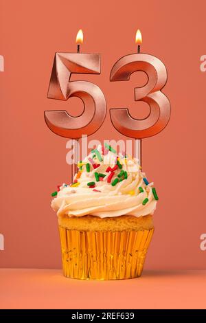 Birthday cake with candle number 53 - Coral fusion background Stock Photo