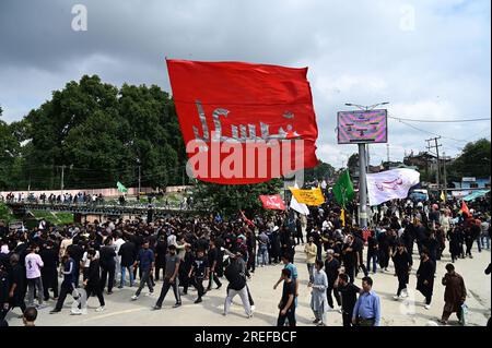 Srinagar, India. 27th July, 2023. SRINAGAR, INDIA - JULY 20: Shia mourners participating in Muharram procession after 3 decades on July 27, 2023 in Srinagar, India. Muharram processions in Srinagar were taken out through the traditional route for the first time in 34 years, with the Jammu and Kashmir administration revoking a 1989 ban which prohibited mourners from marching from Gurubazar to Dalgate.(Photo By Waseem Andrabi/Hindustan Times/Sipa USA)-- Credit: Sipa USA/Alamy Live News Stock Photo