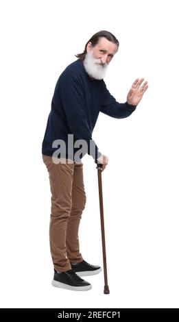Senior man with walking cane waving on white background Stock Photo - Alamy
