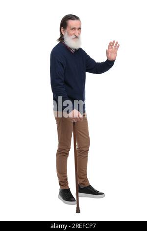 Senior man with walking cane waving on white background Stock Photo - Alamy
