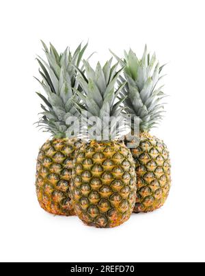 Three delicious ripe pineapples on white background Stock Photo