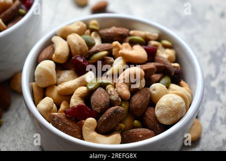 Healthy trail mix in a white bowl Stock Photo